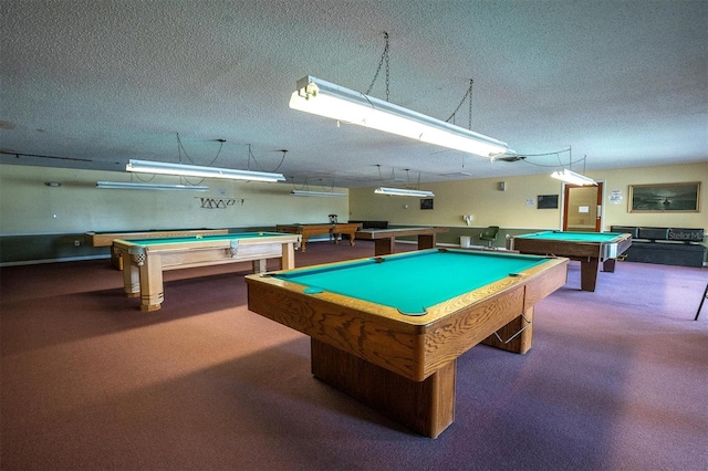 rec room with pool table and a textured ceiling