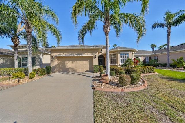 single story home with a garage and a front yard