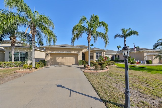 view of front facade featuring a garage and a front lawn