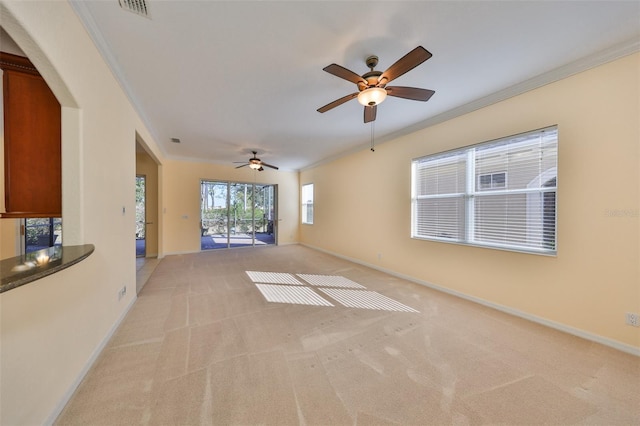 carpeted spare room featuring ornamental molding