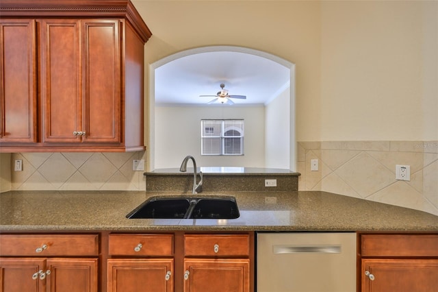 kitchen featuring sink, crown molding, stainless steel dishwasher, ceiling fan, and decorative backsplash