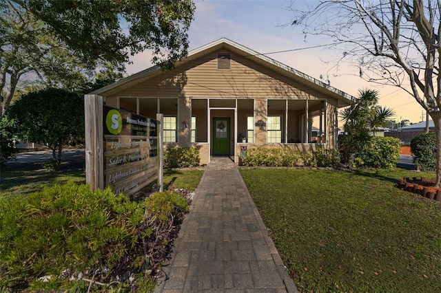 view of front of home with a yard