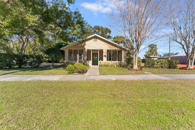 bungalow-style house with a front lawn and a porch