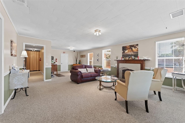 carpeted living room featuring a brick fireplace