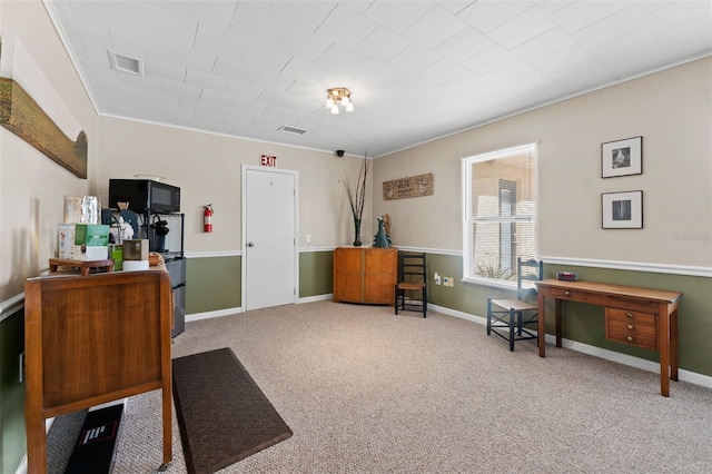 miscellaneous room featuring ornamental molding and carpet flooring