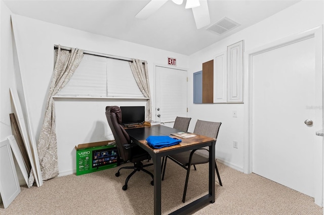 home office with ceiling fan and light colored carpet