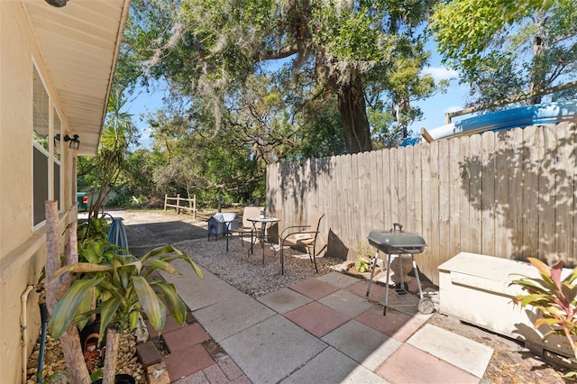 view of patio with a grill