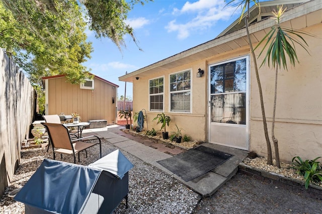 view of patio / terrace featuring an outbuilding