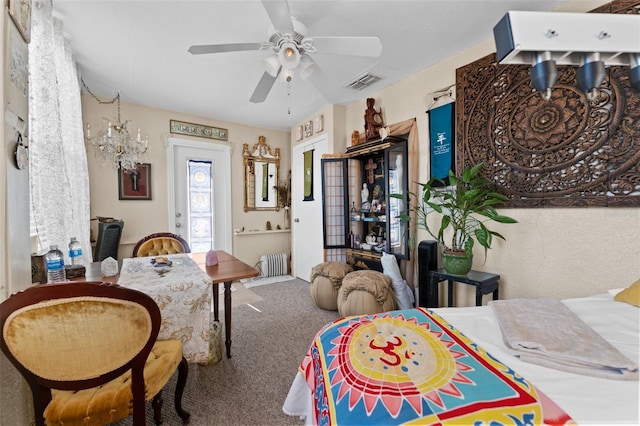 interior space featuring ceiling fan with notable chandelier, radiator heating unit, and access to outside