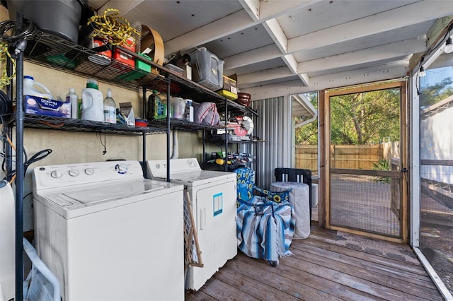 laundry area featuring separate washer and dryer and hardwood / wood-style flooring