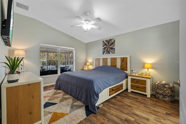 bedroom featuring vaulted ceiling, dark hardwood / wood-style floors, and ceiling fan