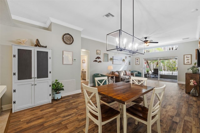 dining room featuring crown molding, dark wood-type flooring, and ceiling fan