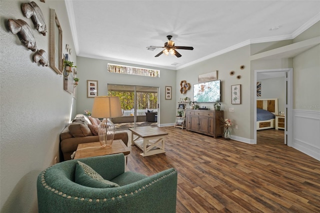 living room featuring ornamental molding, dark hardwood / wood-style floors, and ceiling fan