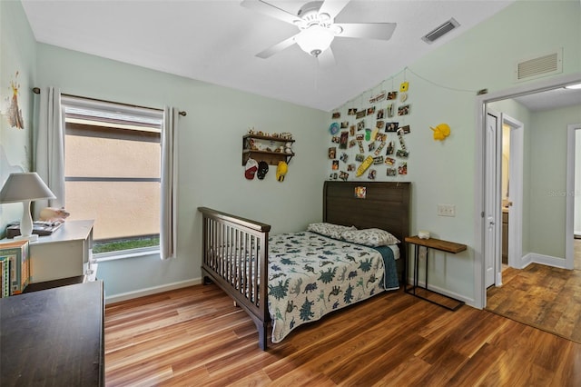 bedroom with hardwood / wood-style flooring and ceiling fan