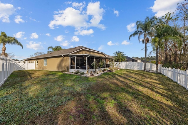 view of yard with a sunroom