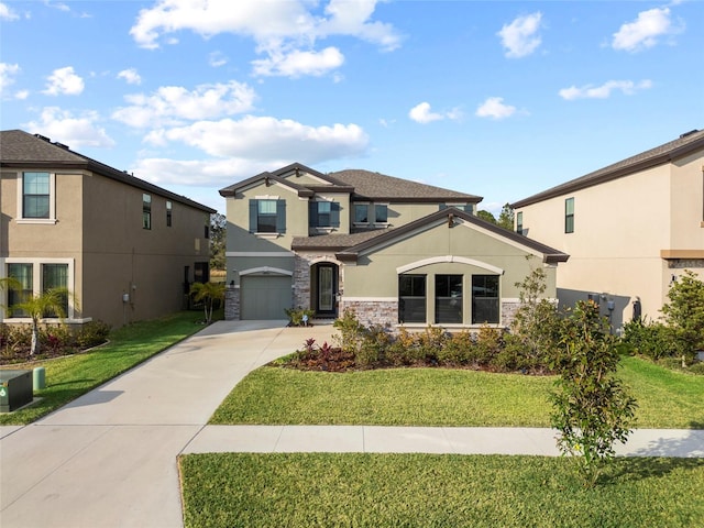 view of front of property featuring a garage and a front lawn