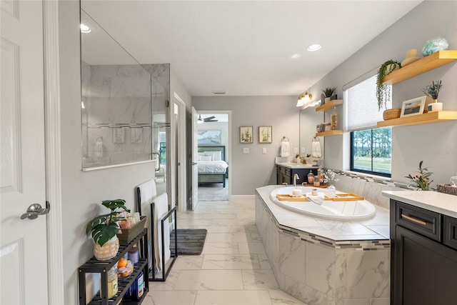 bathroom with vanity and separate shower and tub