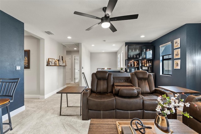 living room with ceiling fan and light colored carpet