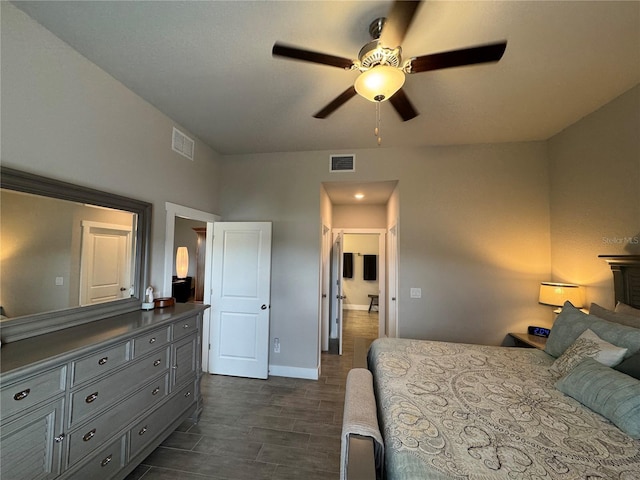 bedroom with ceiling fan and dark hardwood / wood-style flooring