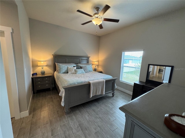 bedroom with ceiling fan and dark hardwood / wood-style flooring