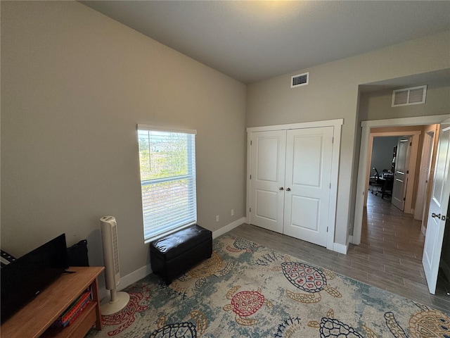 bedroom featuring hardwood / wood-style flooring and a closet