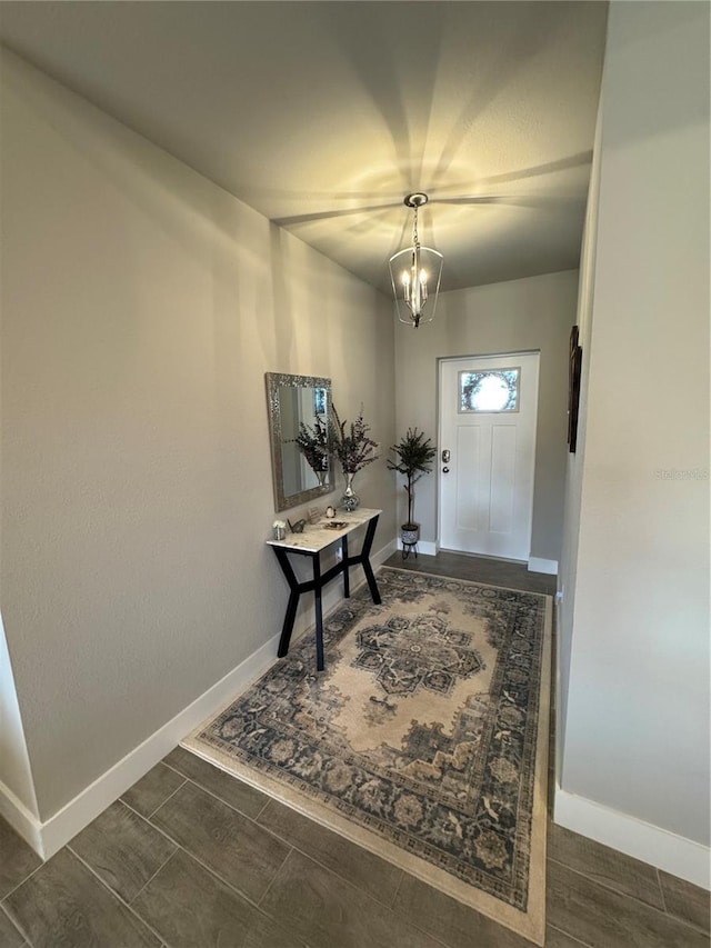 entryway with a chandelier