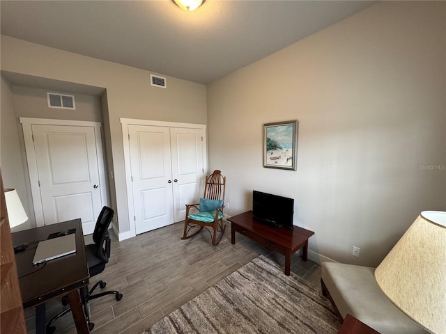 office space with hardwood / wood-style floors