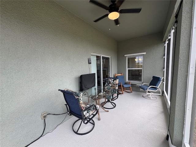 sunroom featuring ceiling fan and lofted ceiling