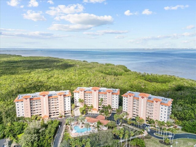 birds eye view of property with a water view