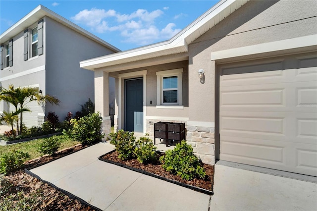 doorway to property featuring a garage