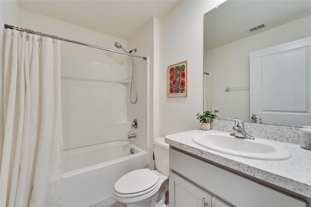 full bathroom featuring vanity, shower / bathtub combination with curtain, and toilet