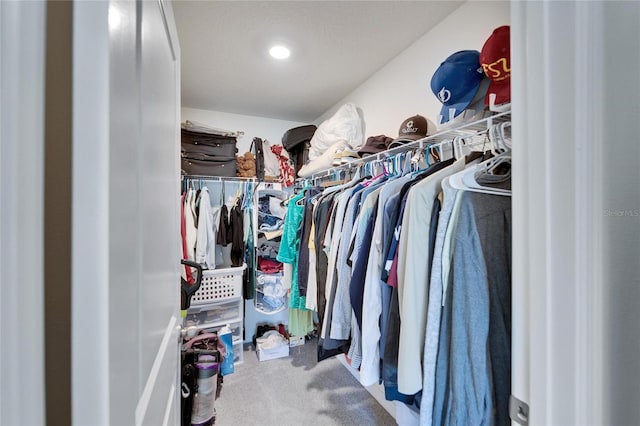 spacious closet with carpet floors