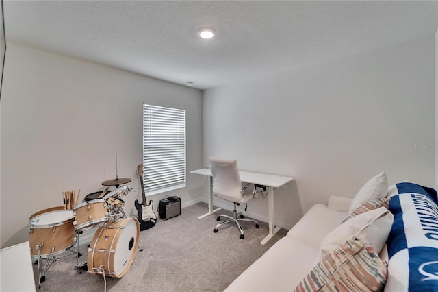 carpeted office with a textured ceiling