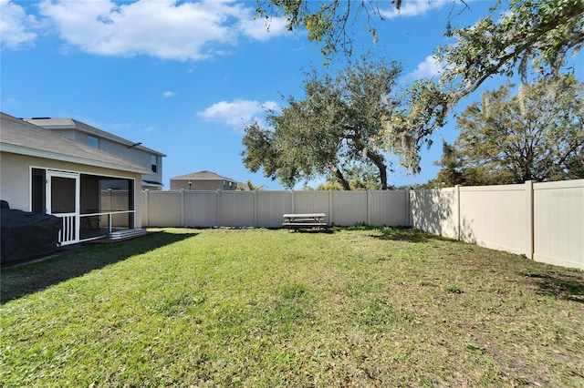 view of yard with a sunroom