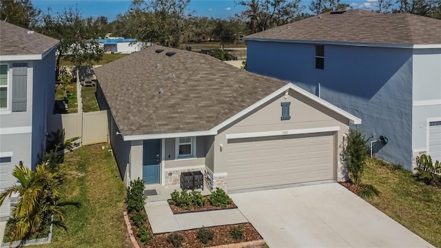 view of front of property with a garage and a front yard