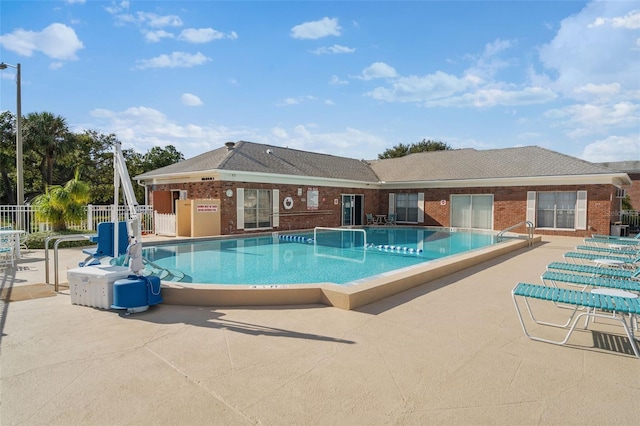 view of swimming pool with a patio