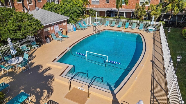 view of swimming pool with a patio area