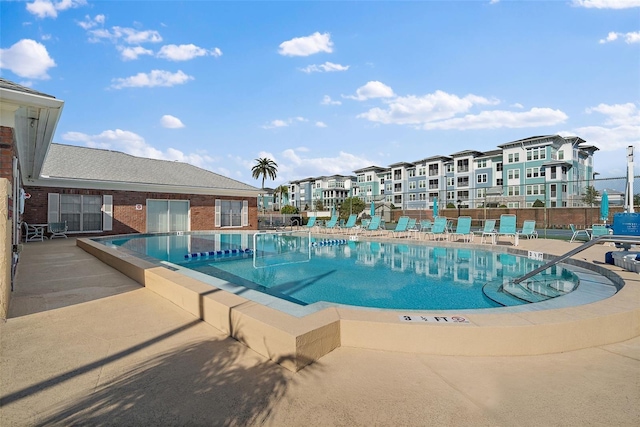 view of swimming pool featuring a patio