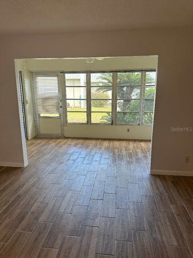 empty room with hardwood / wood-style floors