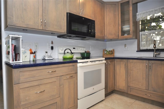 kitchen featuring white electric stove, sink, light tile patterned floors, and backsplash