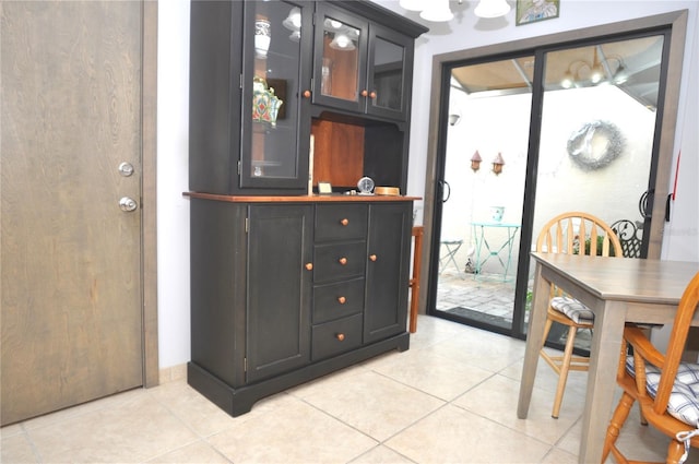 bar featuring light tile patterned flooring