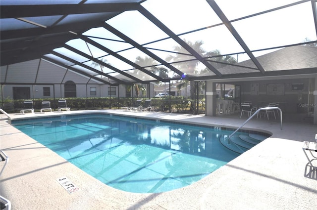 view of pool featuring a lanai and a patio area