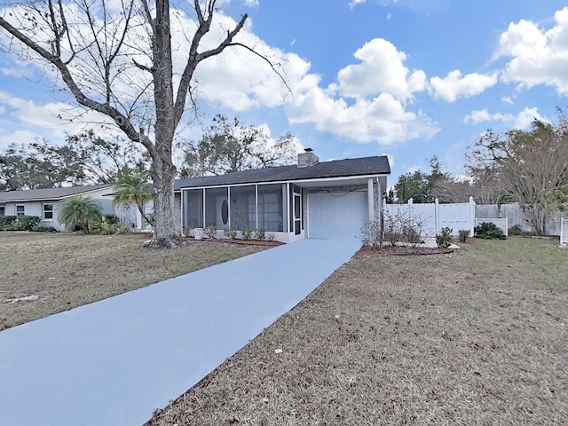 view of front of house with a garage and a front lawn