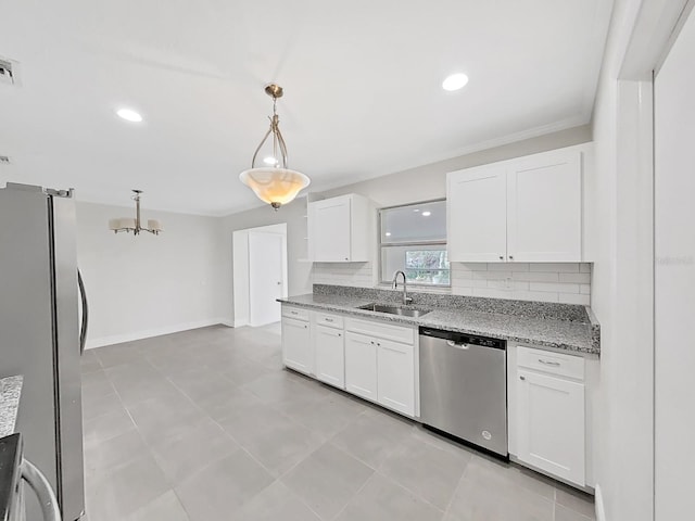 kitchen featuring sink, hanging light fixtures, white cabinets, and appliances with stainless steel finishes