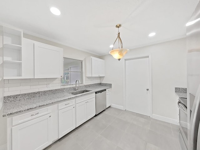 kitchen featuring sink, white cabinetry, backsplash, stainless steel appliances, and decorative light fixtures