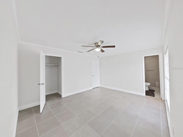 unfurnished bedroom with light tile patterned floors and ceiling fan