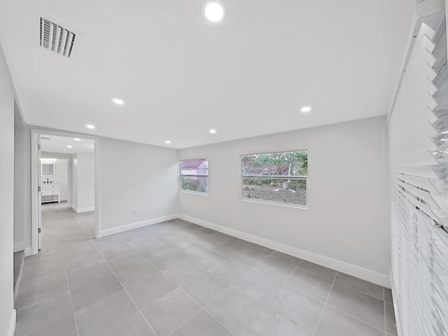 empty room with light tile patterned floors