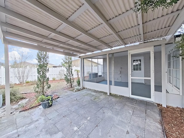 view of patio featuring a sunroom