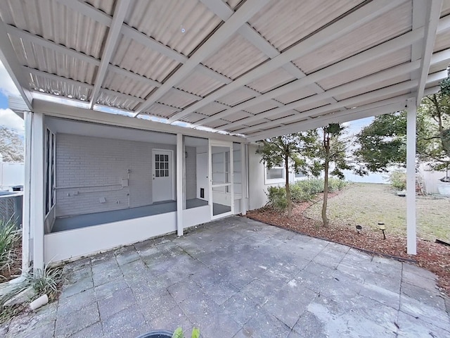 view of patio / terrace with a sunroom