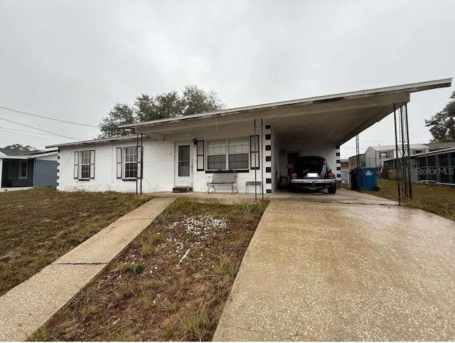 view of front of home with a carport